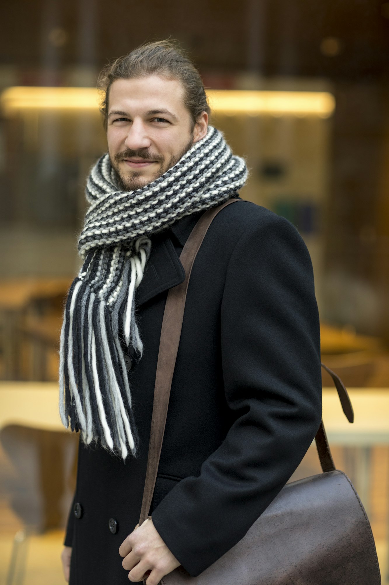 Portrait of man wearing scarf in autumn